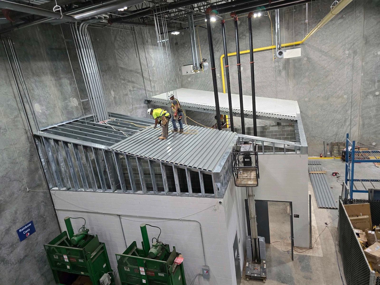 Drywall installation and structural framing progress
